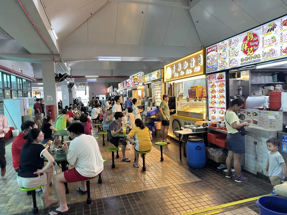 Food stalls and diners at Beauty World Centre food centre in August 2025